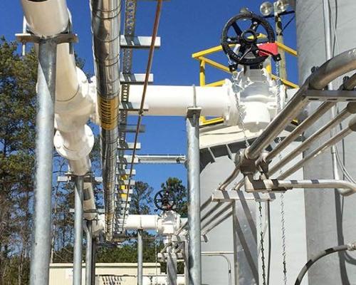 Exterior photo of Greenfield Biologics Facility process tanks and piping